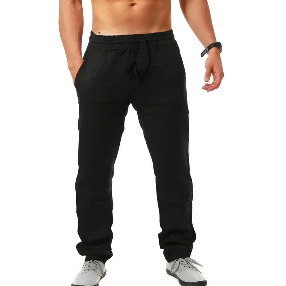 Homme portant un pantalon jogger ample léger, parfait pour une tenue décontractée et stylée printemps-été.