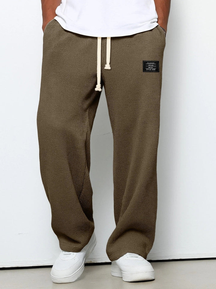 Pantalon homme confortable en coton gaufré, style ample, mode décontractée printemps/été.