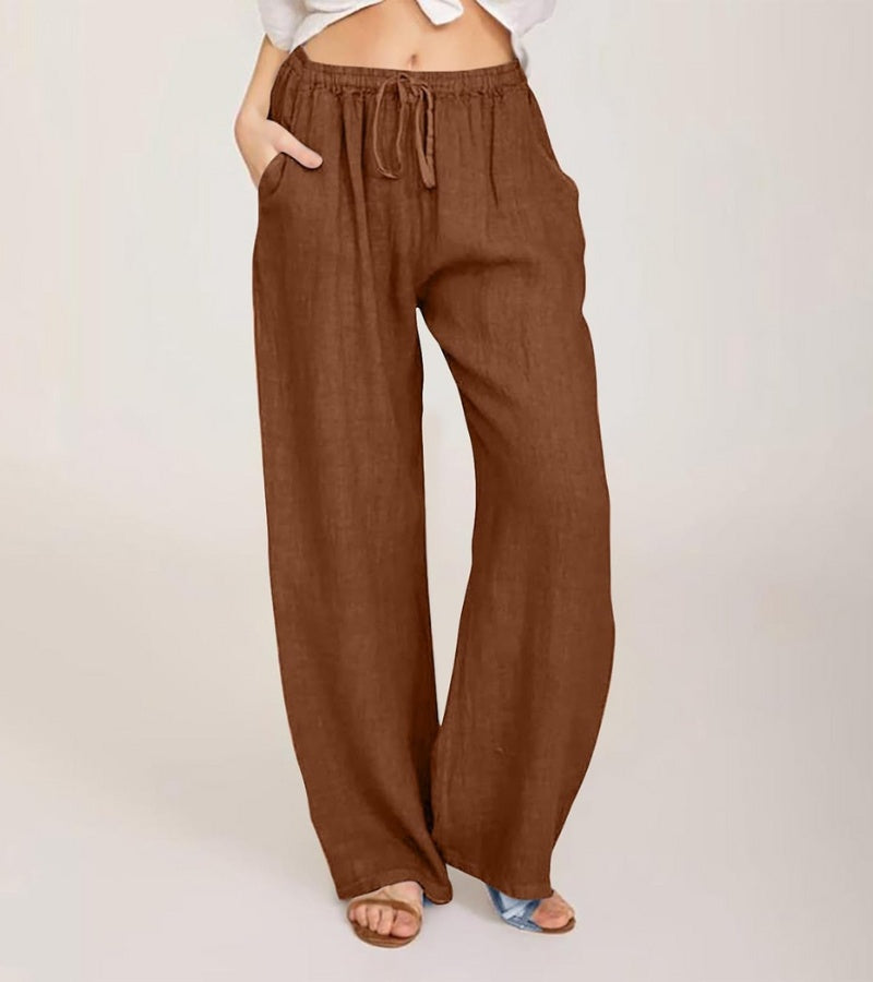 Pantalon de vacances femme, coupe large en lin, style décontracté parfait pour la plage et l'été.