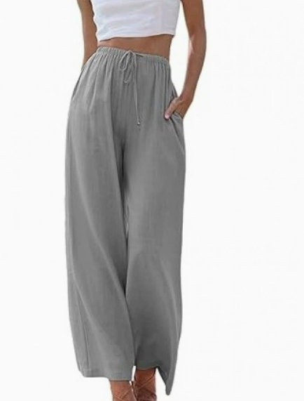 Pantalon large femme en lin, décontracté et fluide, essentiel pour l'élégance estivale et le confort.