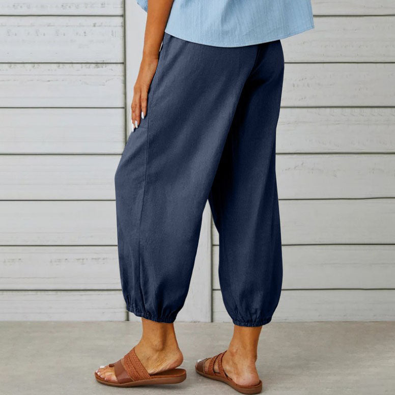 Pantalon femme décontracté-chic, large et fluide en coton. Confortable et élégant pour le printemps-été.