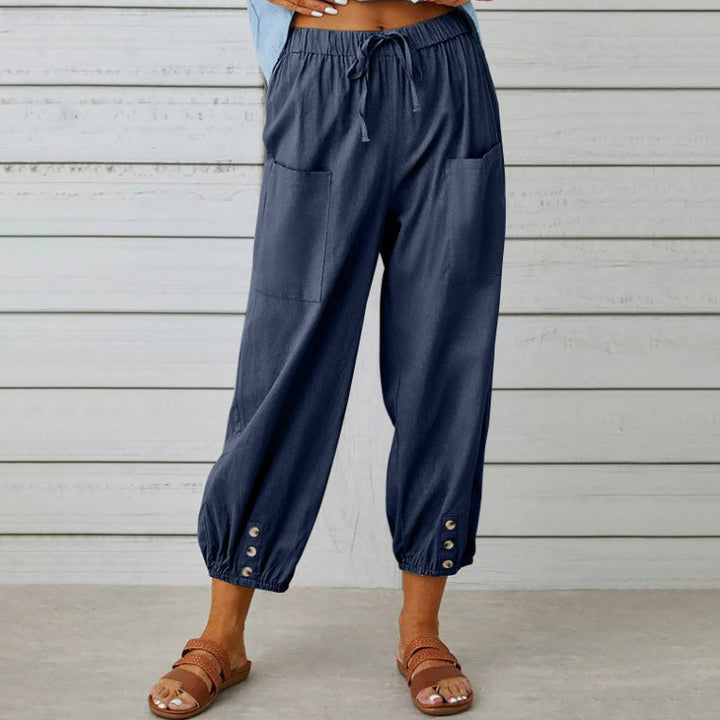 Pantalon d'été pour femme, coupe large et fluide, en tissu léger. Confort et style décontracté pour les beaux jours.