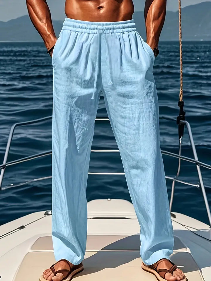 Pantalon homme en lin naturel, coupe ample et respirante, essentiel pour un confort estival décontracté.