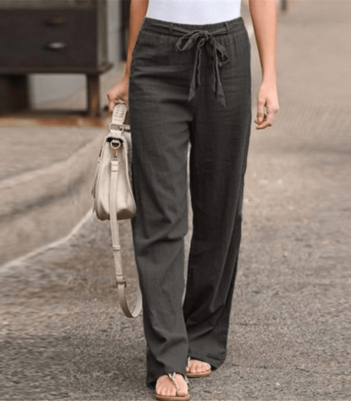 Pantalon large confortable Maisy pour femme, disponible en noir et beige, avec taille élastique.
