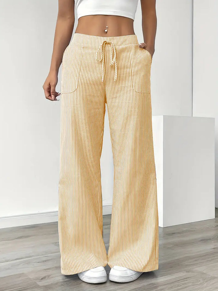 Pantalon large rayé femme taille haute, chic et confortable pour l'été.