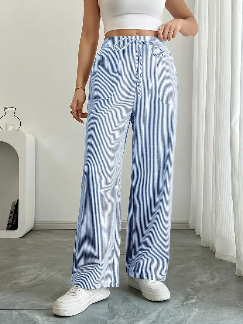 Pantalon été femme, style large, rayé et confortable, avec poches.