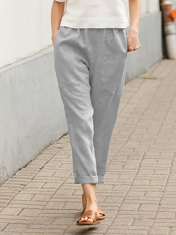 Pantalon taille haute décontracté pour femme, idéal tenue bureau et mode chic.