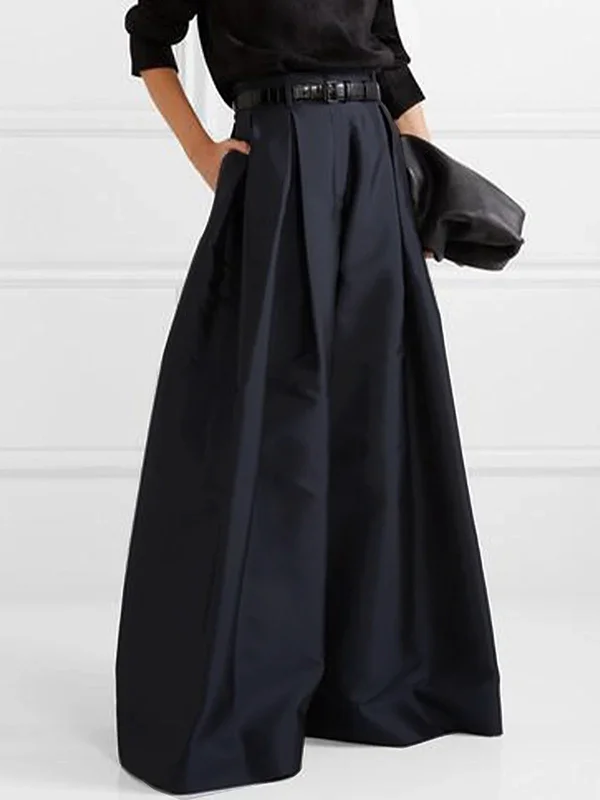 Détail du pantalon plissé femme, taille haute et jambe large, en tissu fluide. Élégance et aisance garanties.