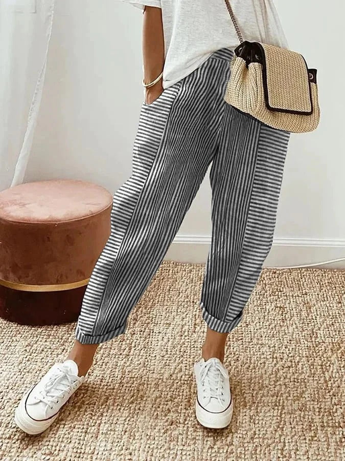 Pantalon rayé en coton pour femme. Style léger et confortable, parfait pour printemps et été.