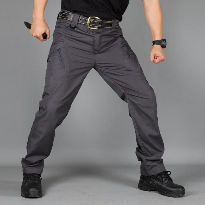 Pantalon cargo homme tactique robuste, stretch, adapté au travail et aux activités exigeantes en extérieur.