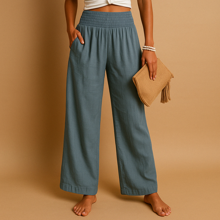 Pantalon femme en lin respirant, taille haute, couleur claire, confort estival décontracté et élégant.