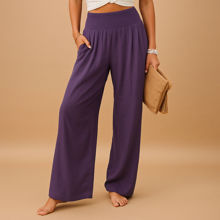 Pantalon femme taille haute en lin, texture douce et coupe fluide. Confortable et élégant pour le printemps.