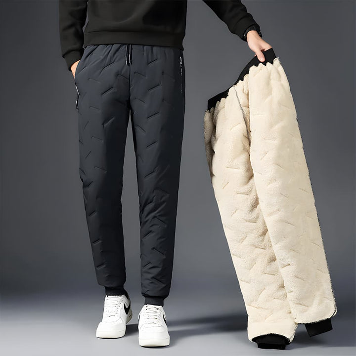 Pantalon thermique femme noir, jogging d'hiver imperméable doublé polaire pour chaleur et confort extérieur.