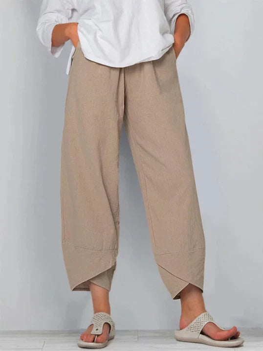 Pantalon trois-quarts ample femme, taille élastique, décontracté et fluide, parfait pour l'été.