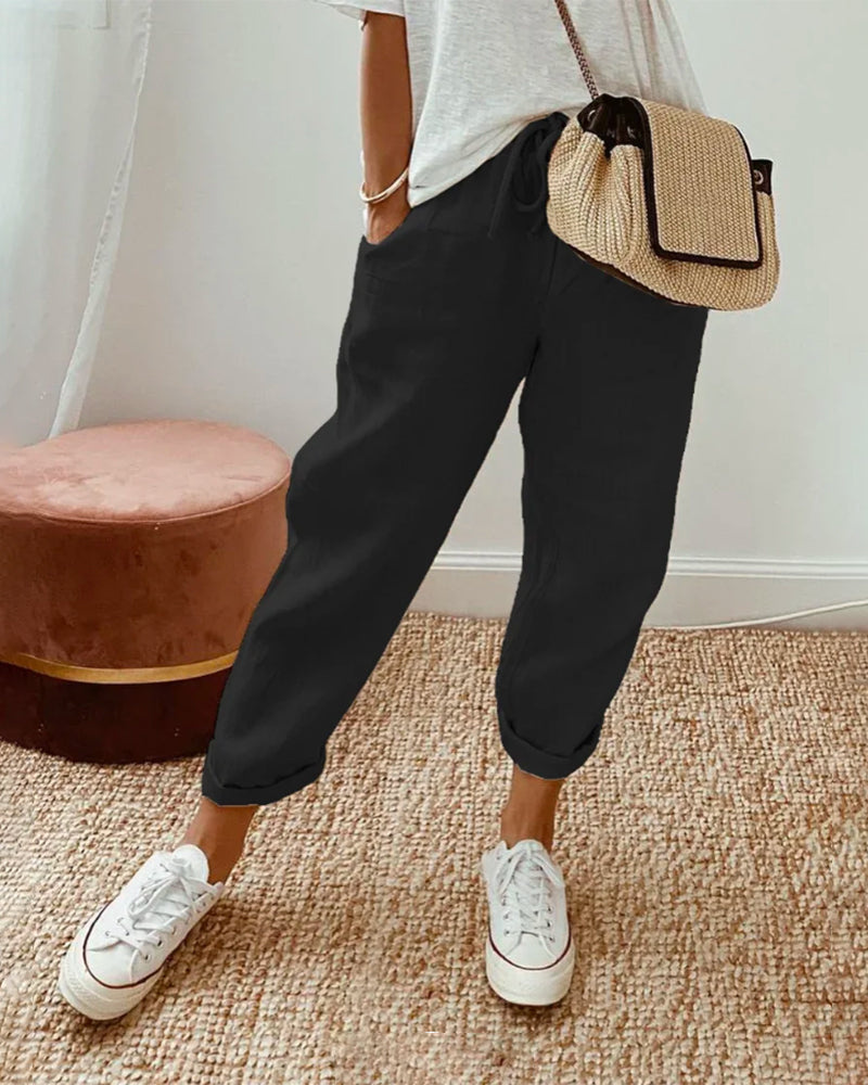 "Pantalon uni en coton lin beige pour femme, léger et élégant, idéal pour l'été, coupe ajustée et confortable."