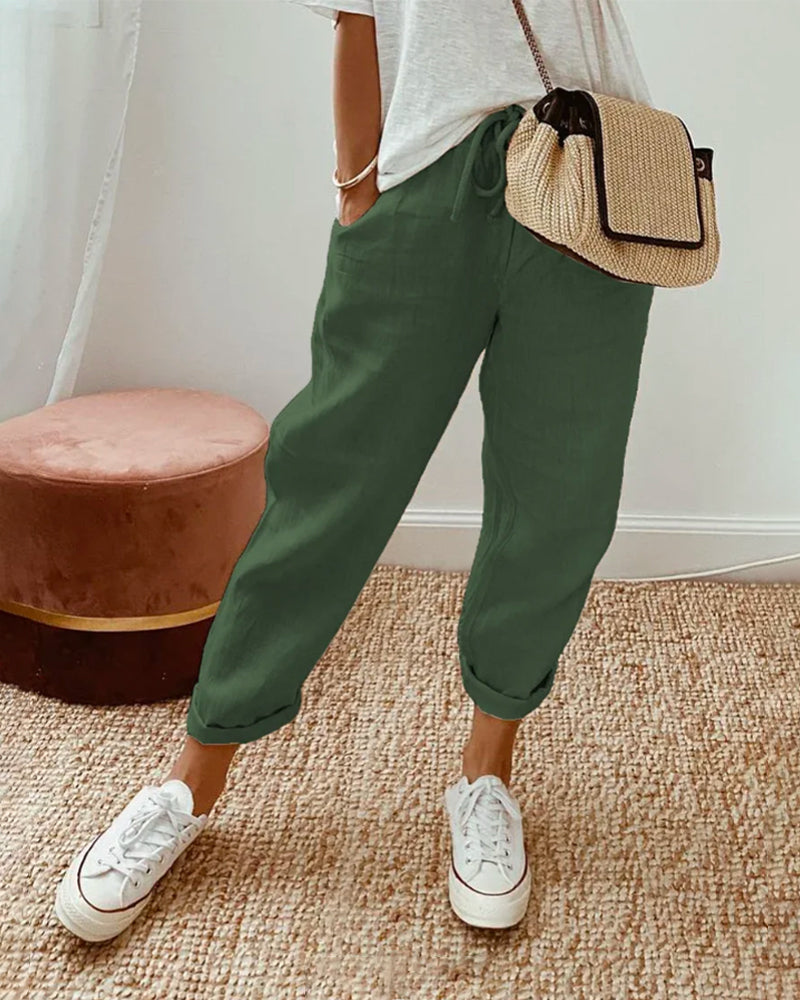 "Pantalon uni en coton lin beige pour femme, léger et élégant, idéal pour l'été, coupe ajustée et confortable."