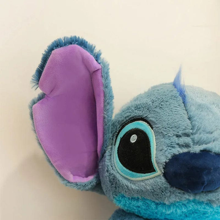Peluche Stitch adorable, douce et câline.  Disponible en 3 tailles : 30cm, 45cm, 60cm.  Parfait pour les enfants.