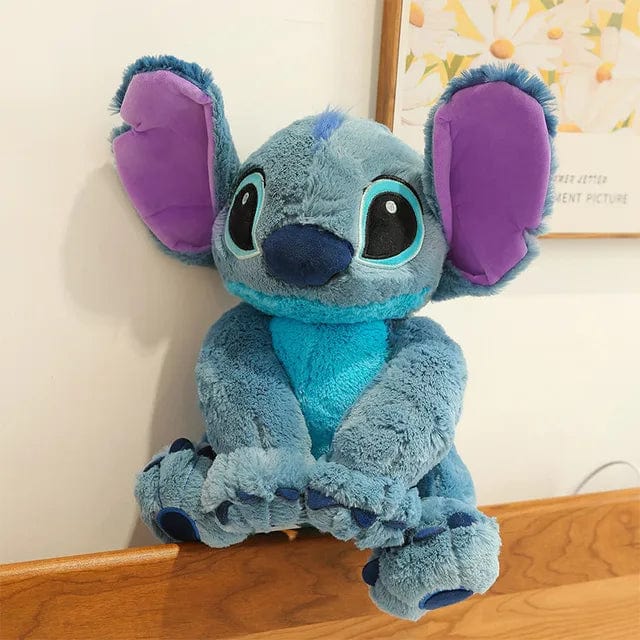 Peluche Stitch adorable, douce et câline.  Disponible en 3 tailles : 30cm, 45cm, 60cm.  Parfait pour les enfants.
