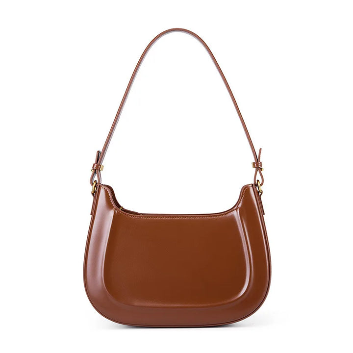 Sac élégant en cuir bordeaux pour femme, porté épaule ou croisé, parfait accessoire de soirée