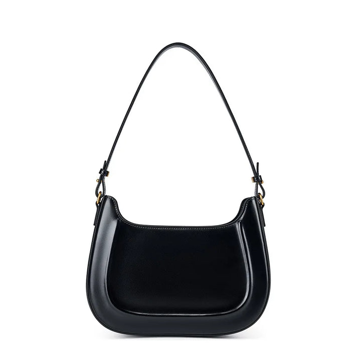 Vue de face d'un petit sac à main en cuir noir, bandoulière fine, pour femme chic et pratique