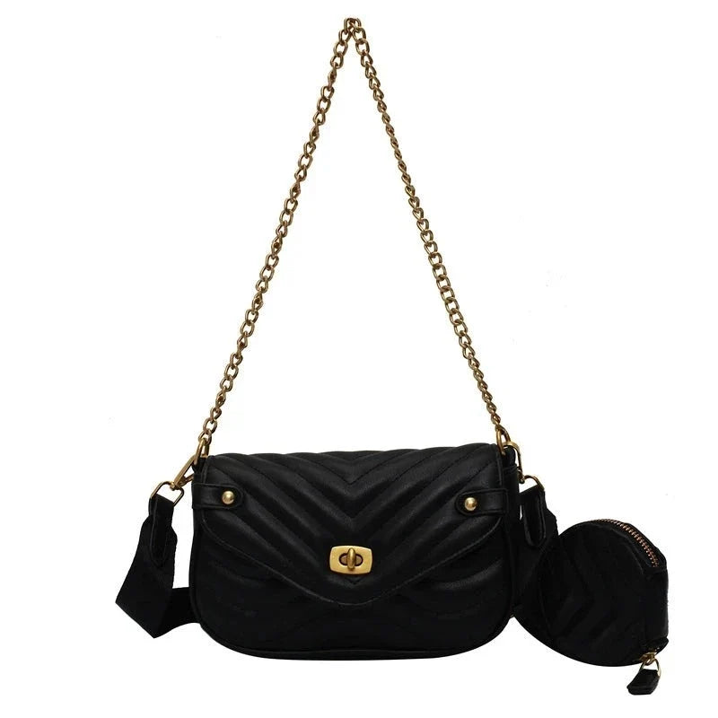 Élégant sac à main femme tendance en cuir PU noir, motif matelassé et bandoulière chaîne dorée.