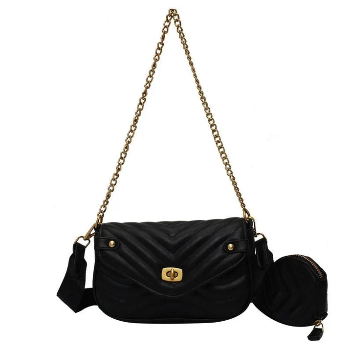 Élégant sac à main femme tendance en cuir PU noir, motif matelassé et bandoulière chaîne dorée.