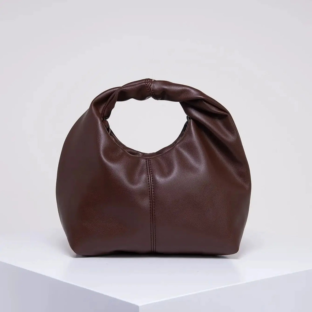 Sac à main polyvalent femme, petit format élégant en cuir synthétique, accessoire mode chic et pratique.