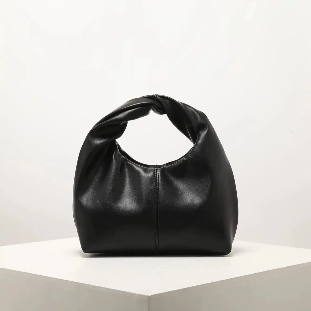 Sac chic et tendance, petit sac à main femme en cuir synthétique élégant, accessoire mode contemporain.