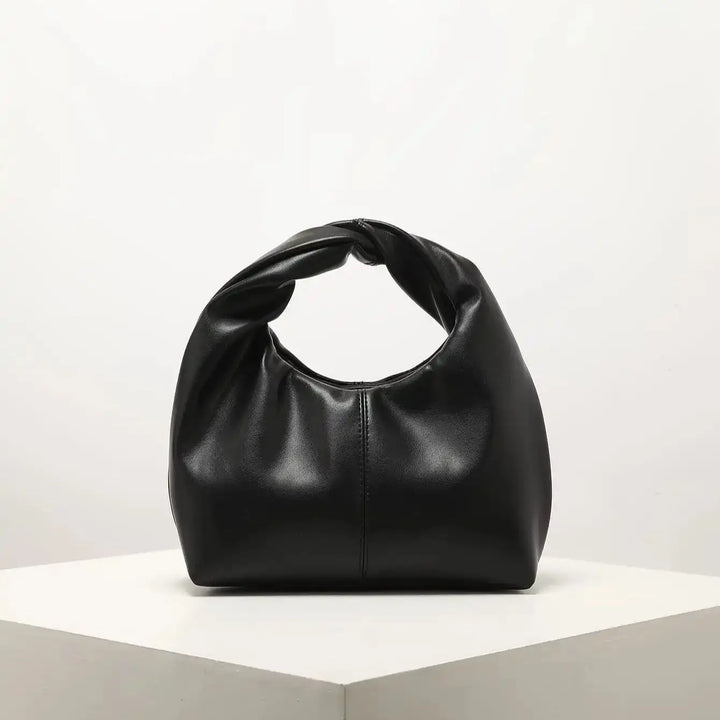 Sac chic et tendance, petit sac à main femme en cuir synthétique élégant, accessoire mode contemporain.
