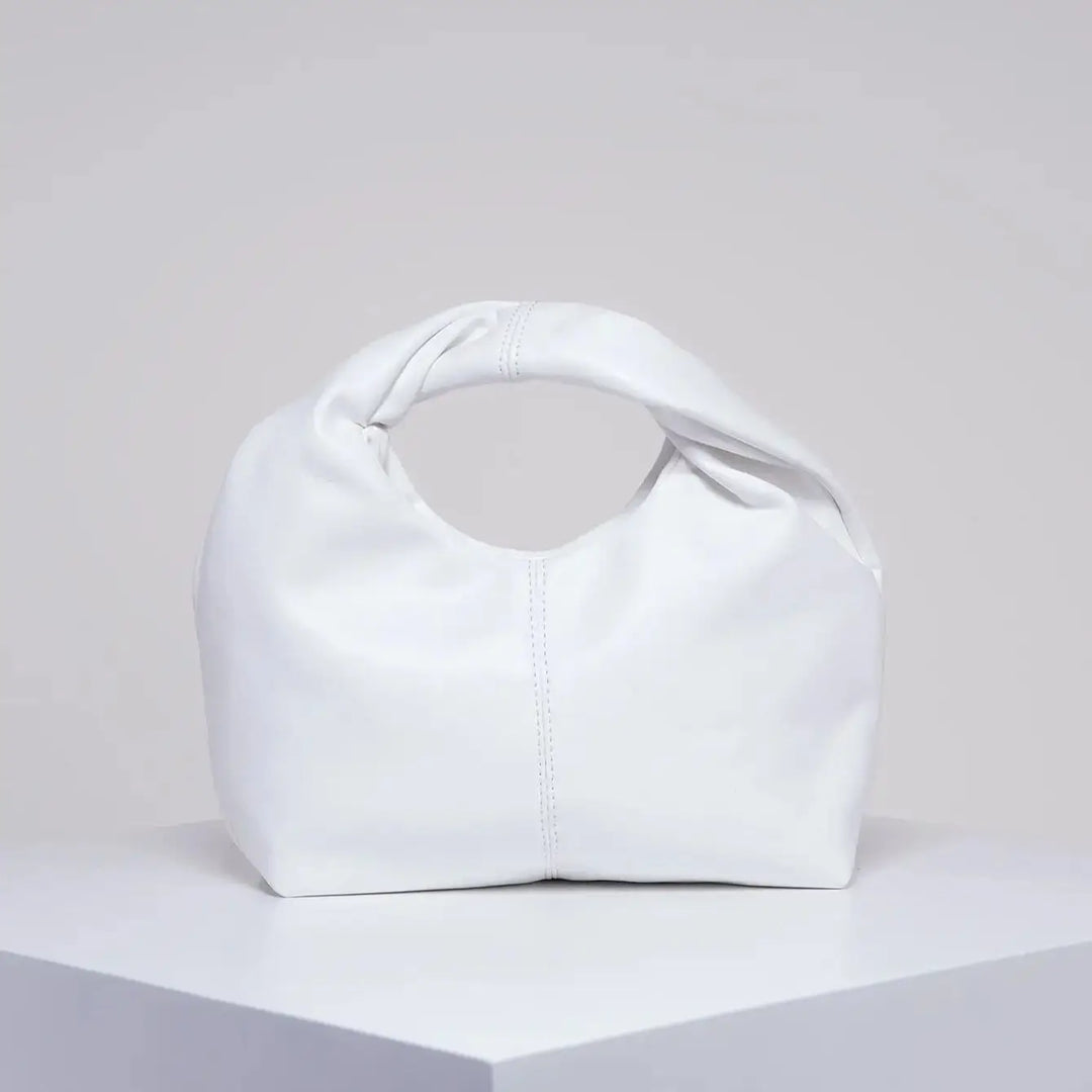 Sac à main élégant pour femme, petit modèle chic en cuir synthétique, accessoire mode discret et tendance.