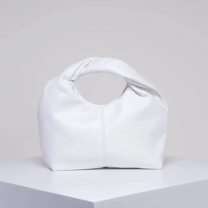 Sac à main élégant pour femme, petit modèle chic en cuir synthétique, accessoire mode discret et tendance.