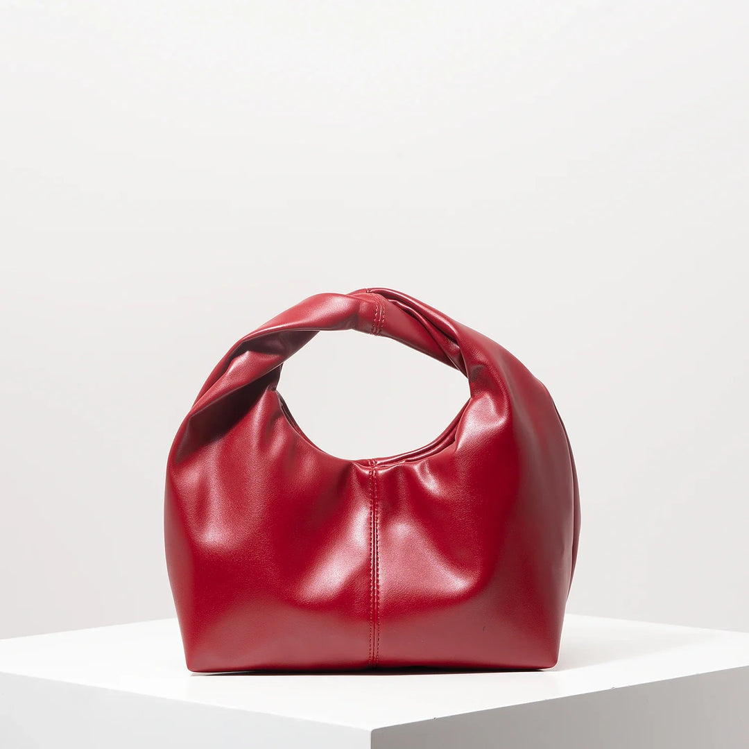 Accessoire mode femme: petit sac à main tendance, chic et élégant en cuir synthétique, polyvalent.