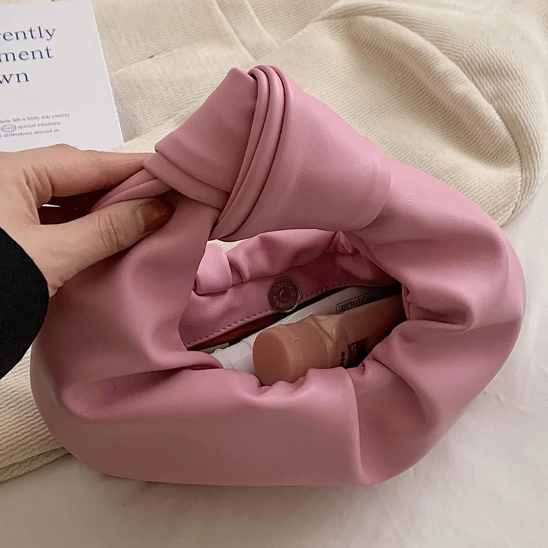 Sac à main rond en cuir synthétique, design moderne et compact pour femme, parfait pour la mode et les soirées d'été.