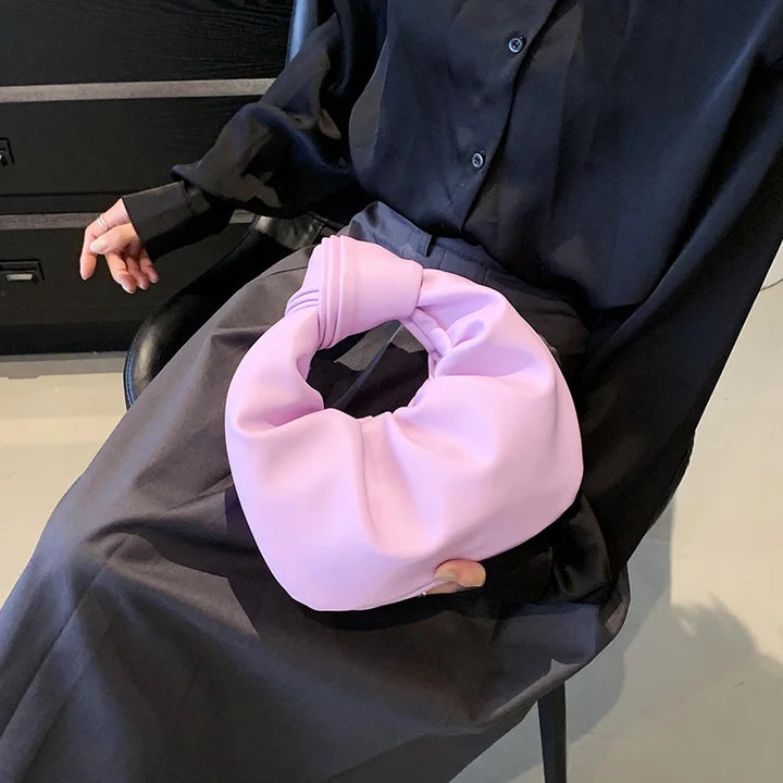 Sac à main rond polyvalent pour femme, en cuir synthétique, compact et élégant, parfait pour le quotidien ou une soirée.