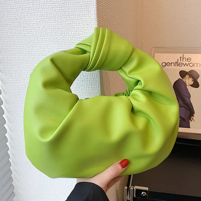 Petit sac à main rond compact pour femme en cuir synthétique, un accessoire mode élégant pour toute occasion.