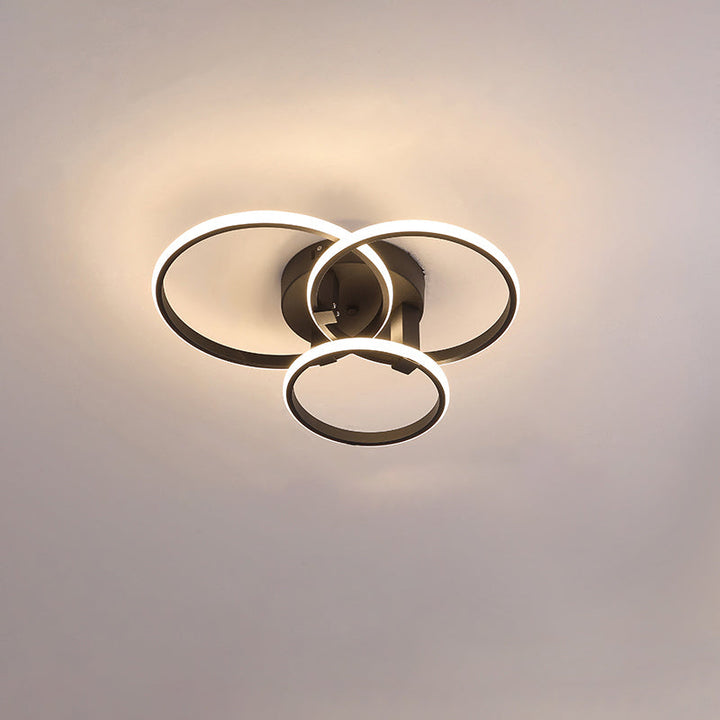 Plafonnier LED moderne, design circulaire, intensité variable.  Éclairage blanc.