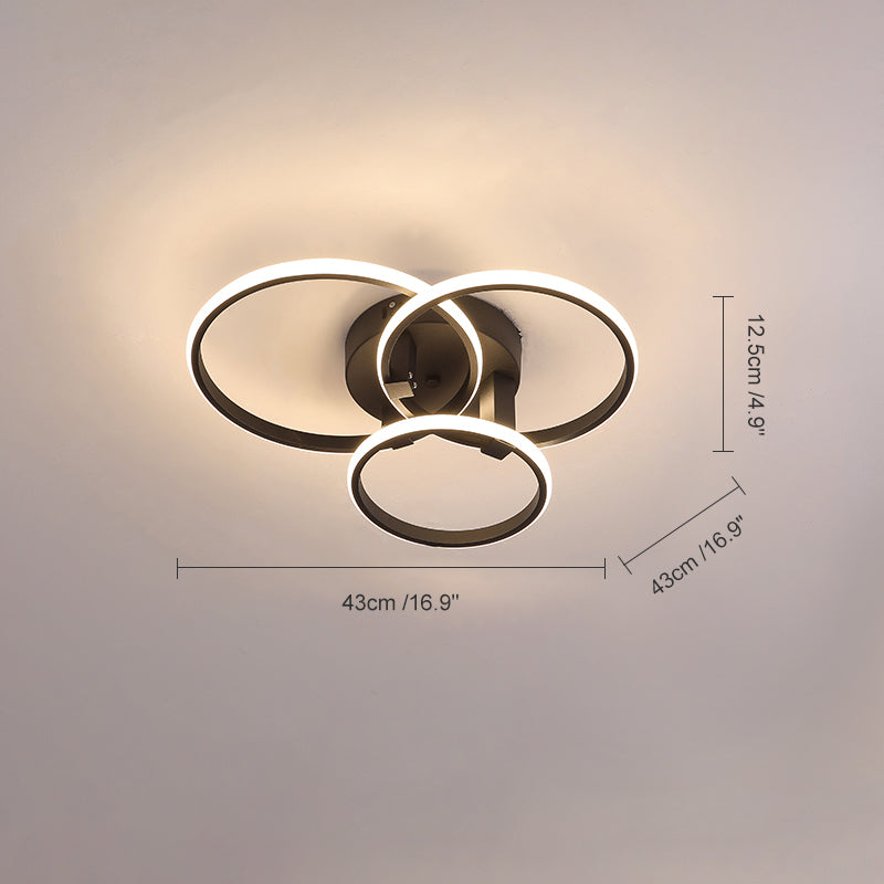 Plafonnier LED moderne, design circulaire, intensité variable.  Éclairage blanc.