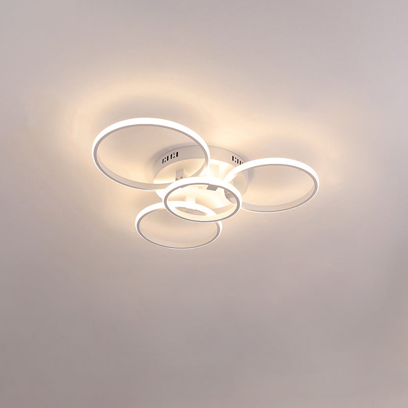 Plafonnier LED moderne, design circulaire, intensité variable.  Éclairage blanc.