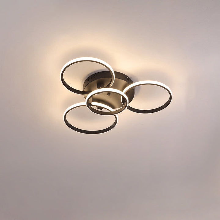Plafonnier LED moderne, design circulaire, intensité variable.  Éclairage blanc.