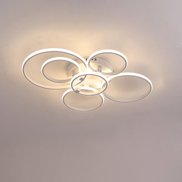 Plafonnier LED moderne, design circulaire, intensité variable.  Éclairage blanc.