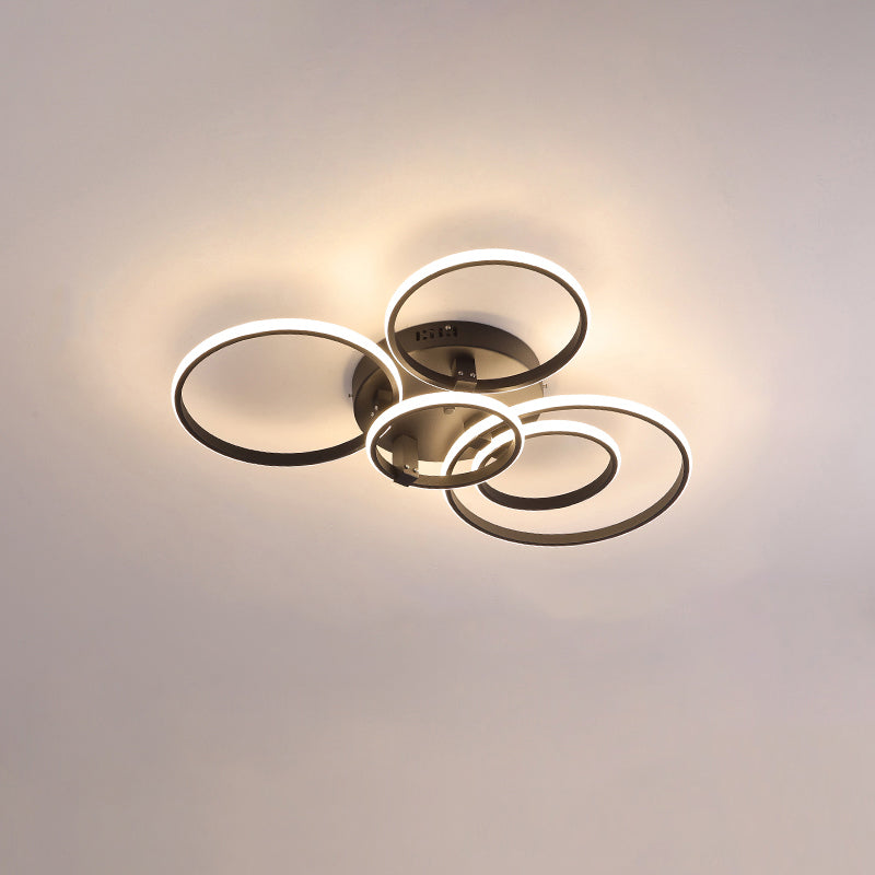 Plafonnier LED moderne, design circulaire, intensité variable.  Éclairage blanc.