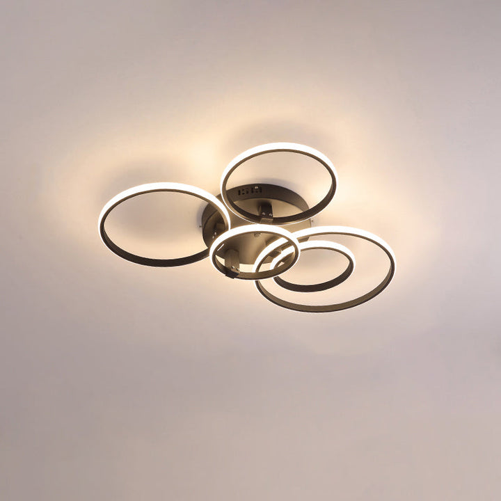 Plafonnier LED moderne, design circulaire, intensité variable.  Éclairage blanc.