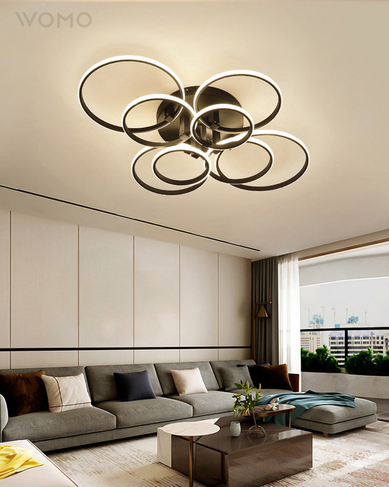 Plafonnier LED moderne, design circulaire, intensité variable.  Éclairage blanc.