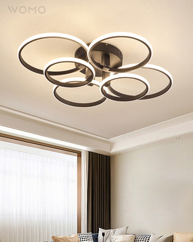 Plafonnier LED moderne, design circulaire, intensité variable.  Éclairage blanc.