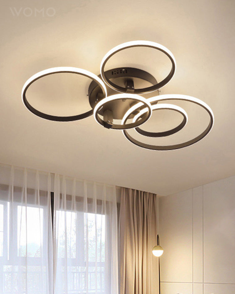 Plafonnier LED moderne, design circulaire, intensité variable.  Éclairage blanc.