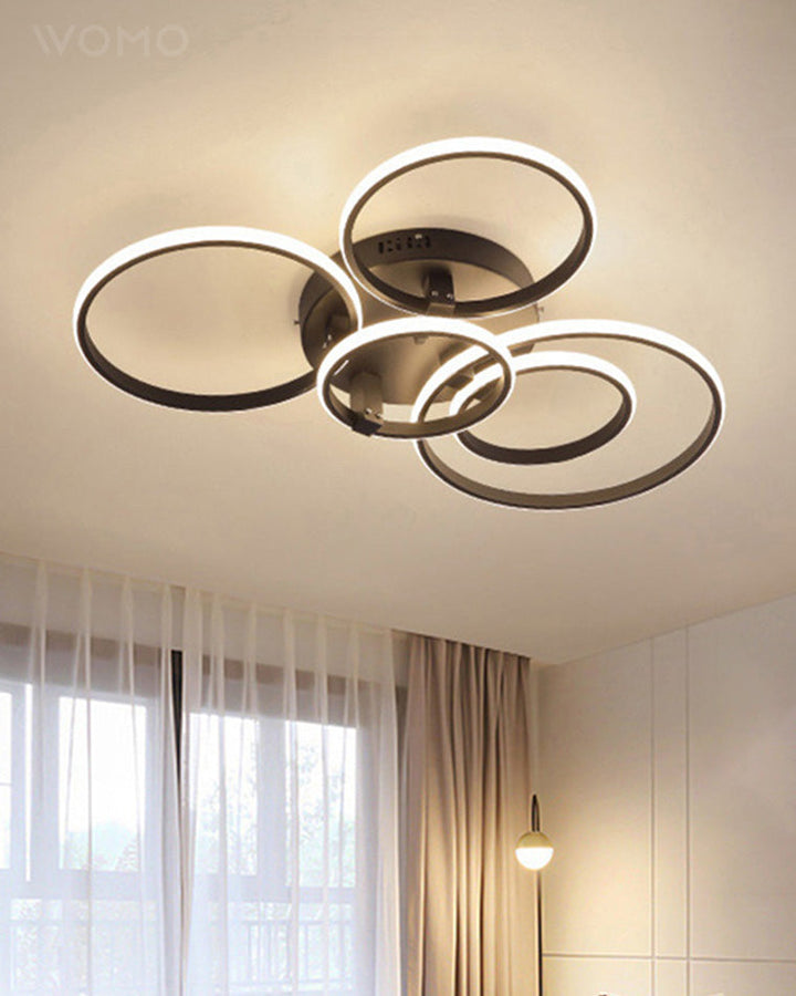 Plafonnier LED moderne, design circulaire, intensité variable.  Éclairage blanc.