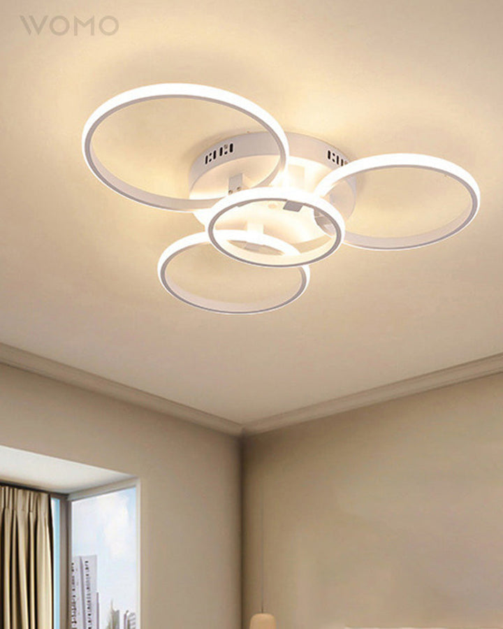 Plafonnier LED moderne, design circulaire, intensité variable.  Éclairage blanc.