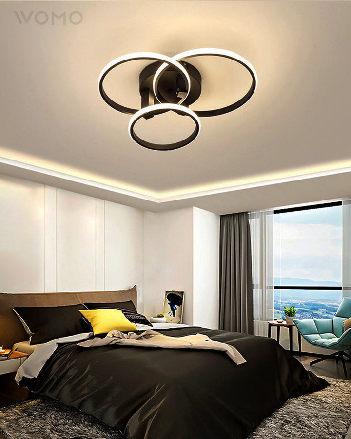 Plafonnier LED moderne, design circulaire, intensité variable.  Éclairage blanc.
