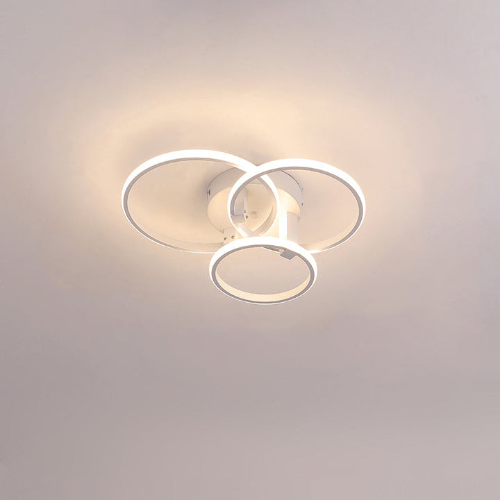 Plafonnier LED moderne, design circulaire, intensité variable.  Éclairage blanc.