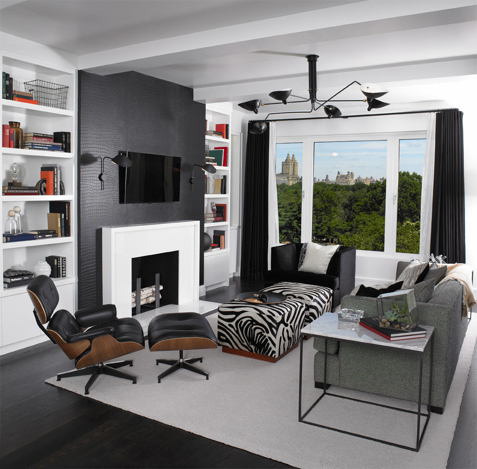 Plafonnier moderne à bras ajustable en métal noir, design élégant et épuré, pour éclairage directionnel contemporain.
